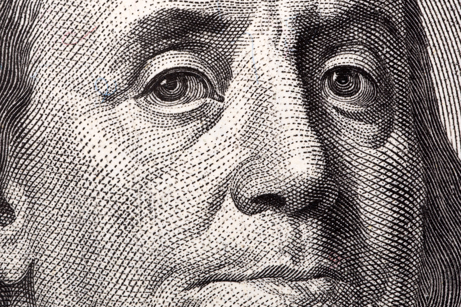 Benjamin Franklin, a close-up portrait from US hundred dolla